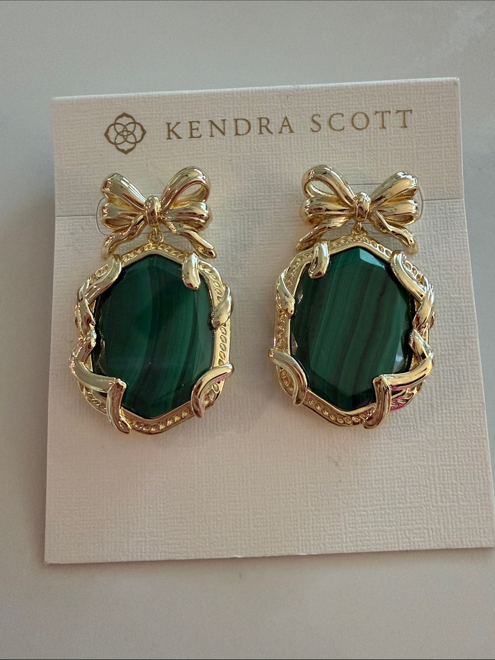 Kendra Scott Gold Bow Earrings with Emerald-Green Stones - Picture 2 of 2